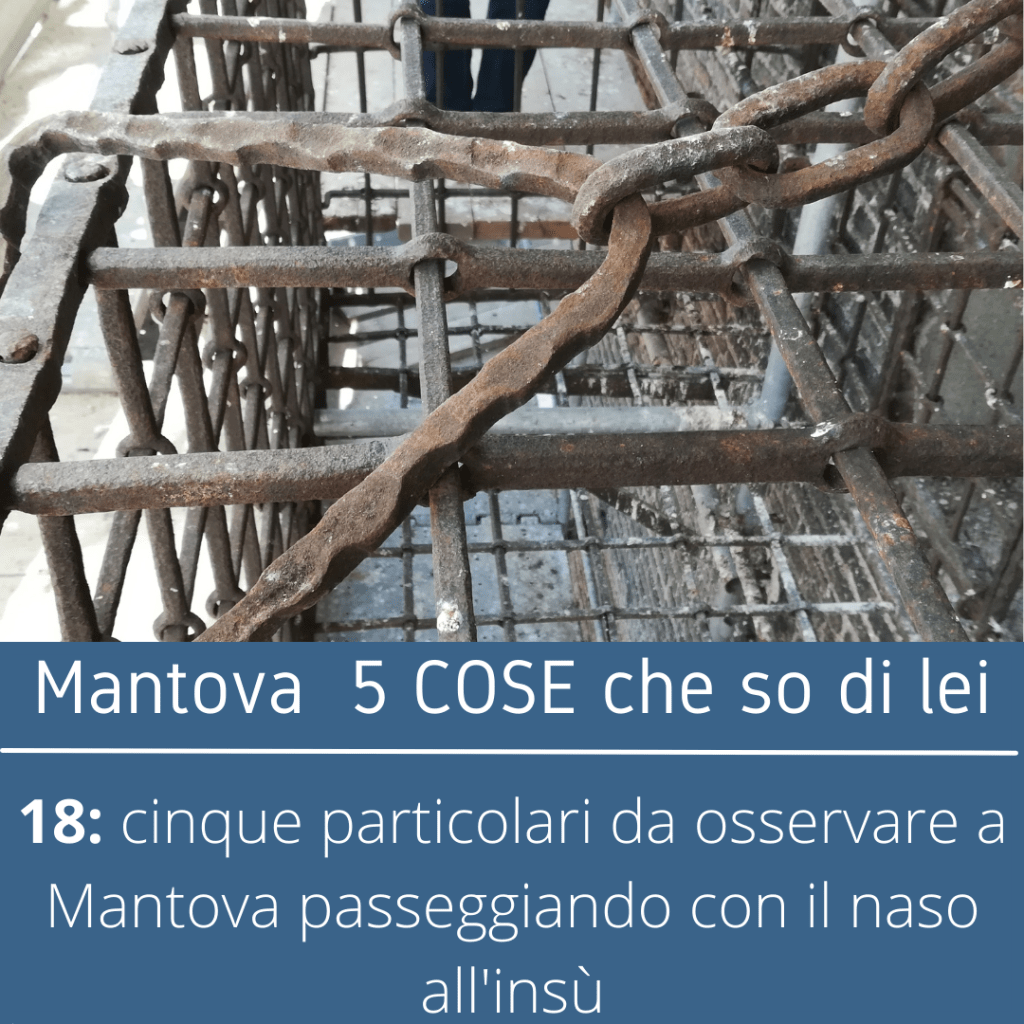 Un particolare della gabbia appesa alla Torre della Gabbia a Mantova.